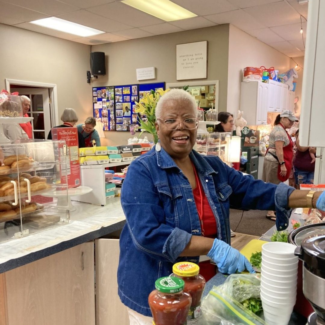 Seniors In Service Ambassador Leona prepares food at the Father & Son Love Free Food Pantry in Odessa, Florida.