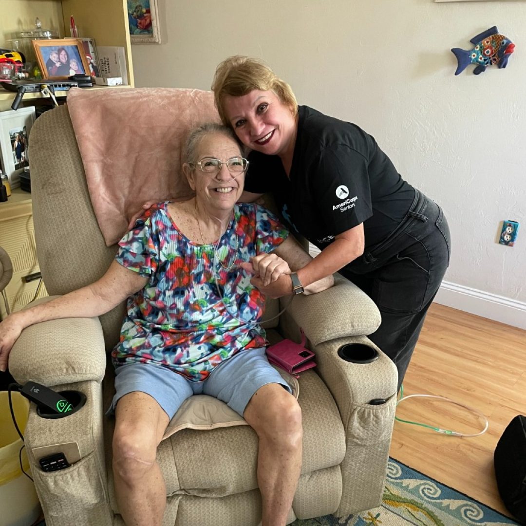 Senior Companion Program volunteer from Seniors in Service visiting with an older adult at home in Tampa Bay, sharing conversation and friendship.